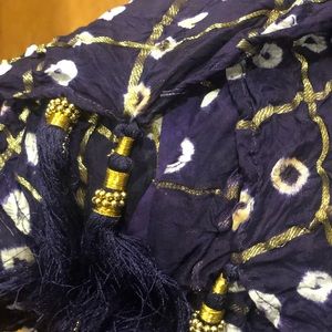 Beautiful shawl with gold thread tassels.